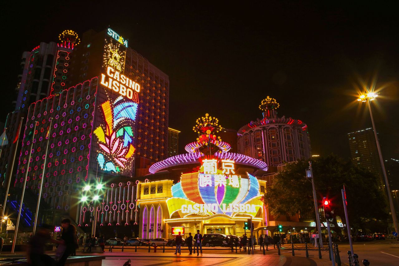 Explore the dazzling lights and vibrant nightlife of Casino Lisboa in Macao, captured beautifully at night.